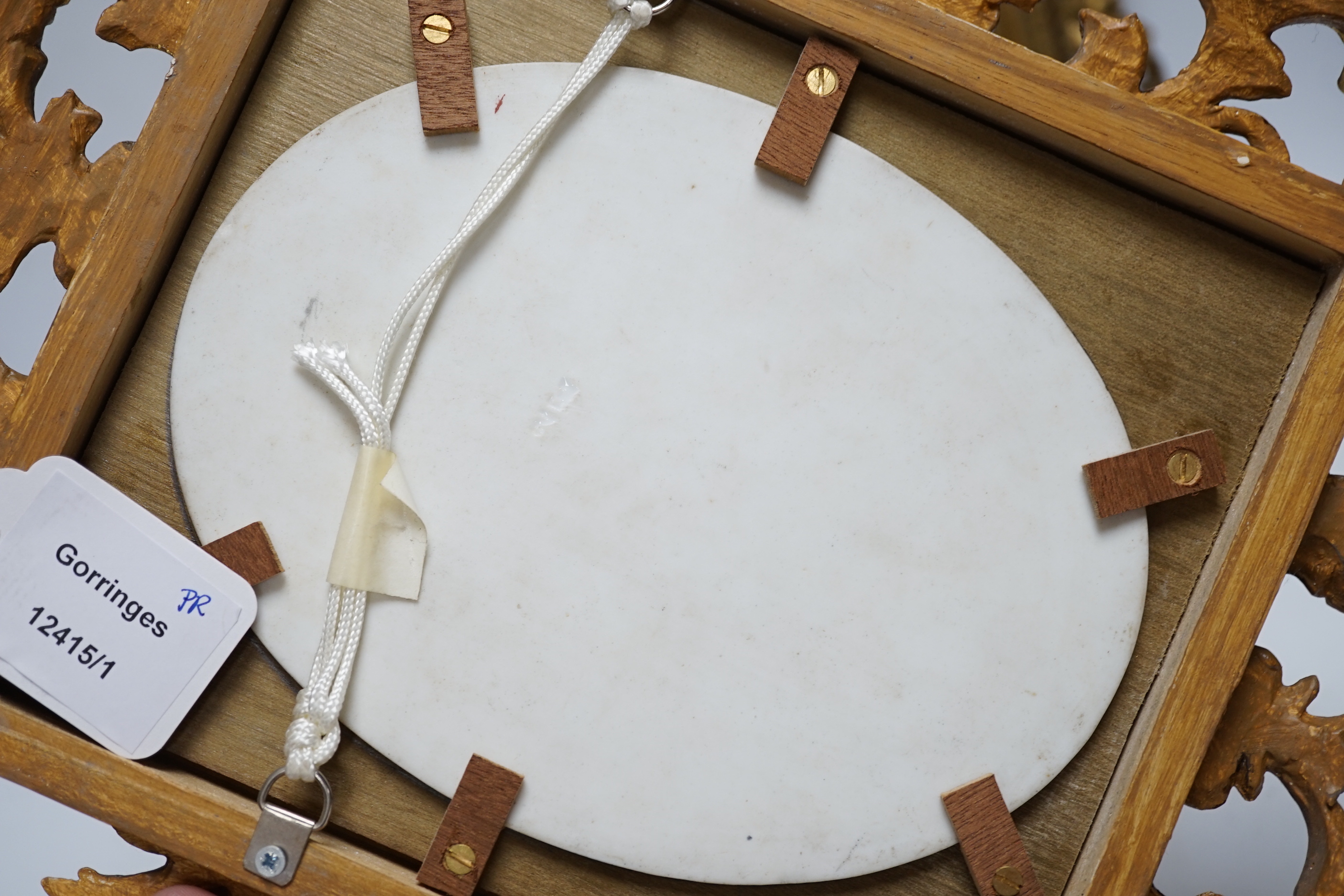 Two 19th century Continental porcelain oval plaques, in similar gilt Florentine frames